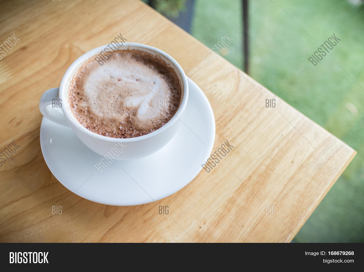 hot coffee mocha with foam milk in countryside cafe