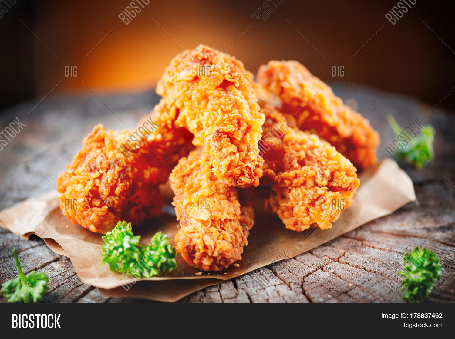 fried chicken wings on wooden table.
