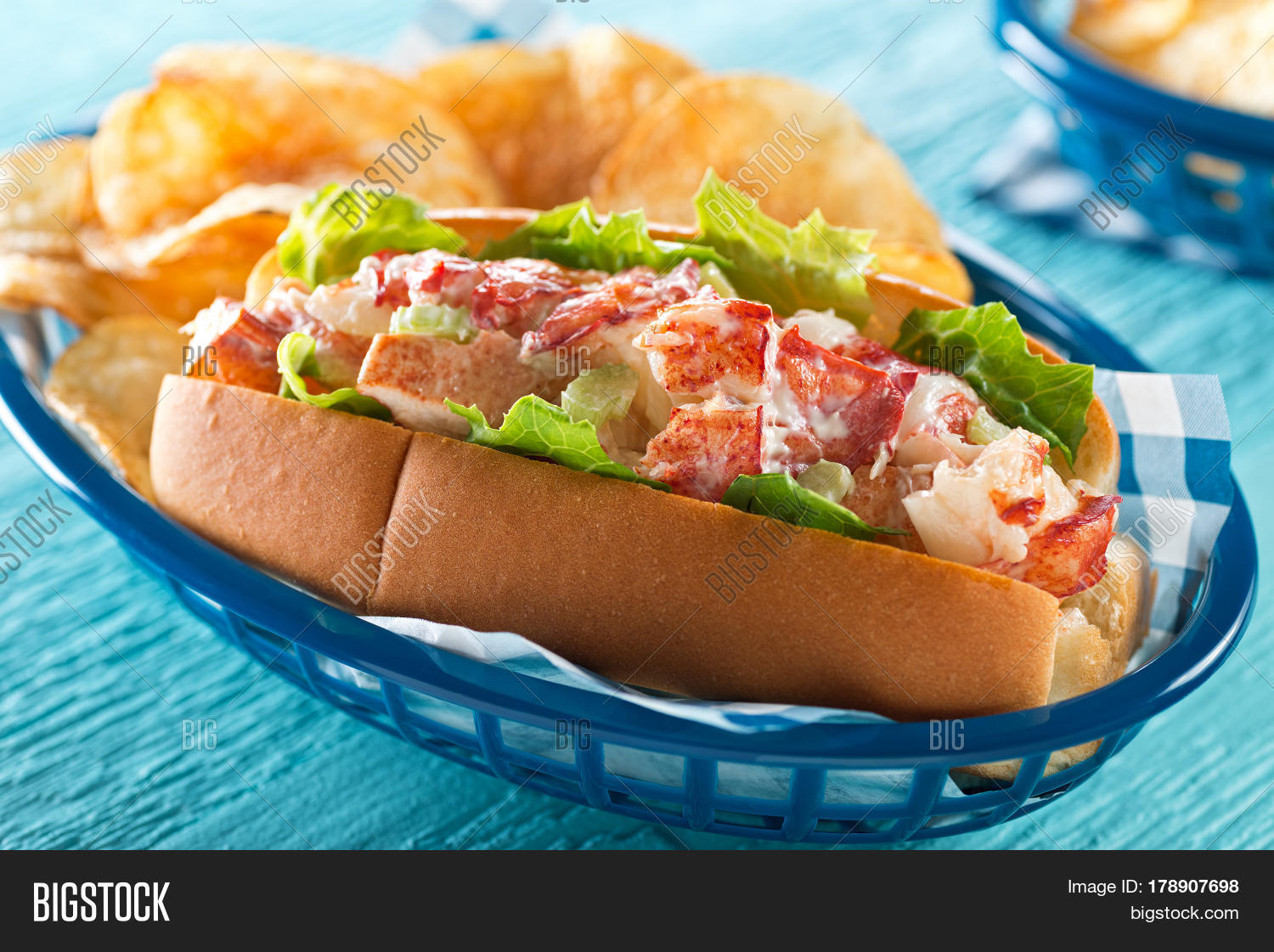 a delicious lobster roll with lettuce celery mayonnaise and