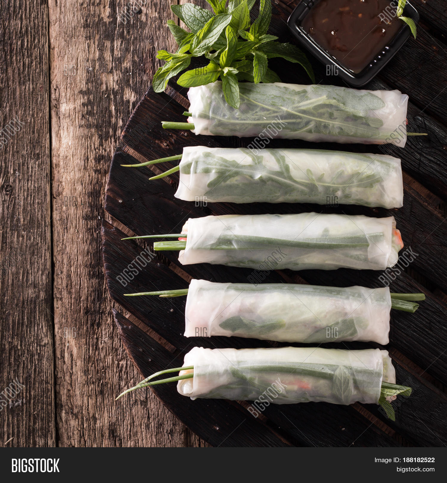 delicious vietnamese spring roll with vegetable on dark back