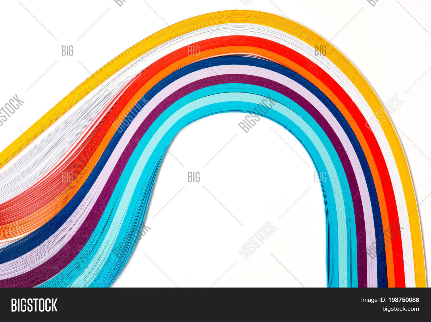 rainbow colored quilling paper laid out in waves and shapes