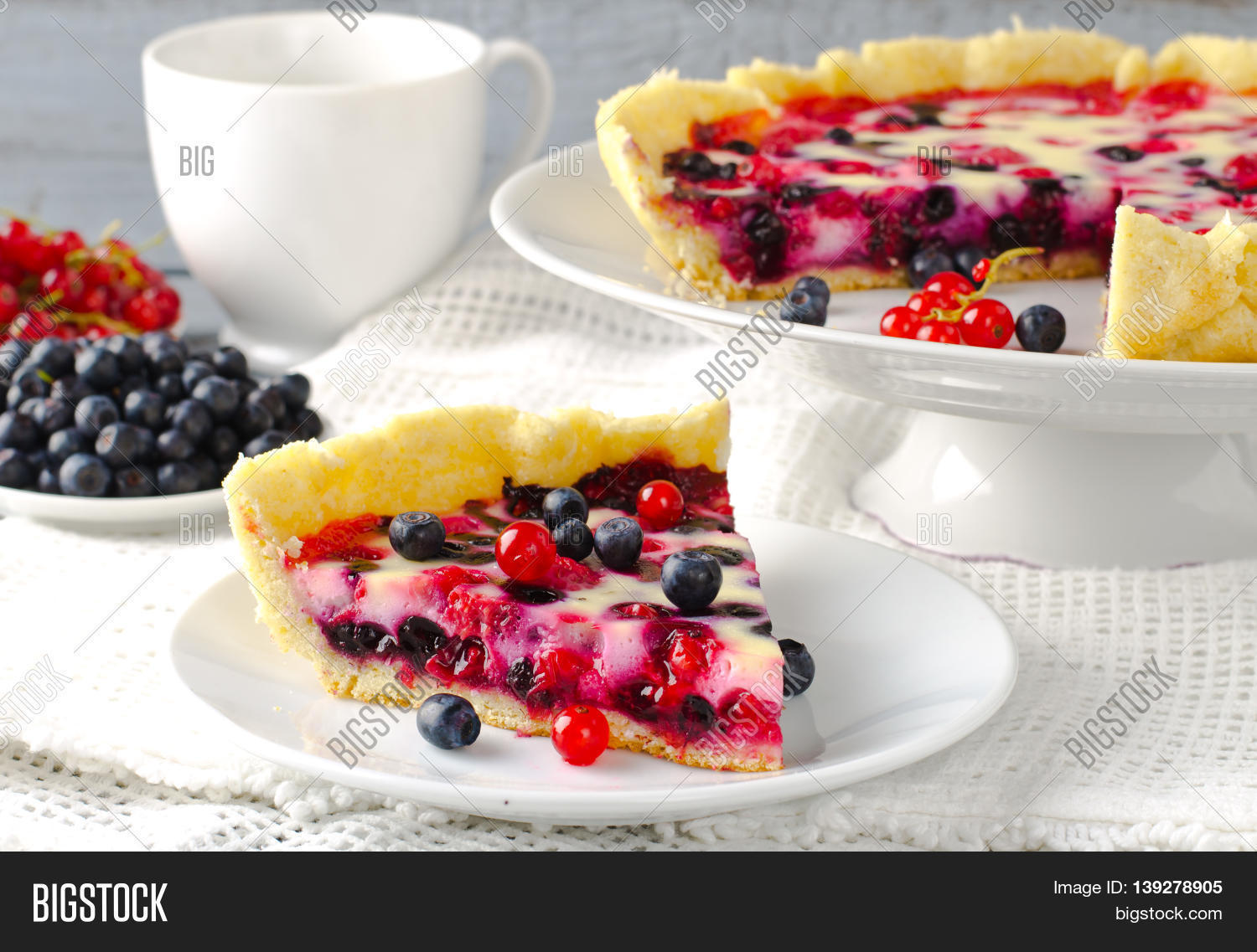 mix berry tart, pie, cake with raspberries, bilberries, blu