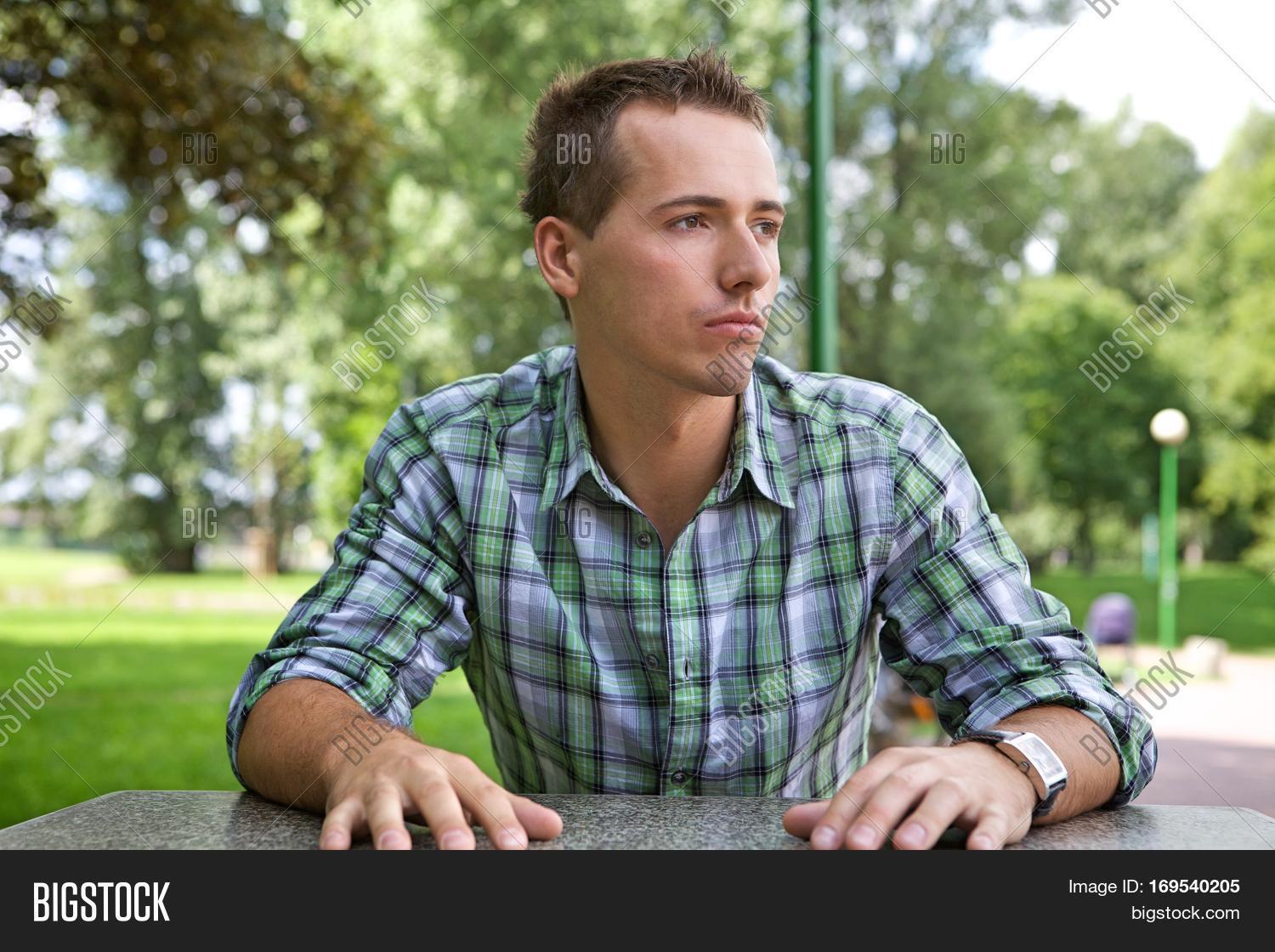 young man contemplating