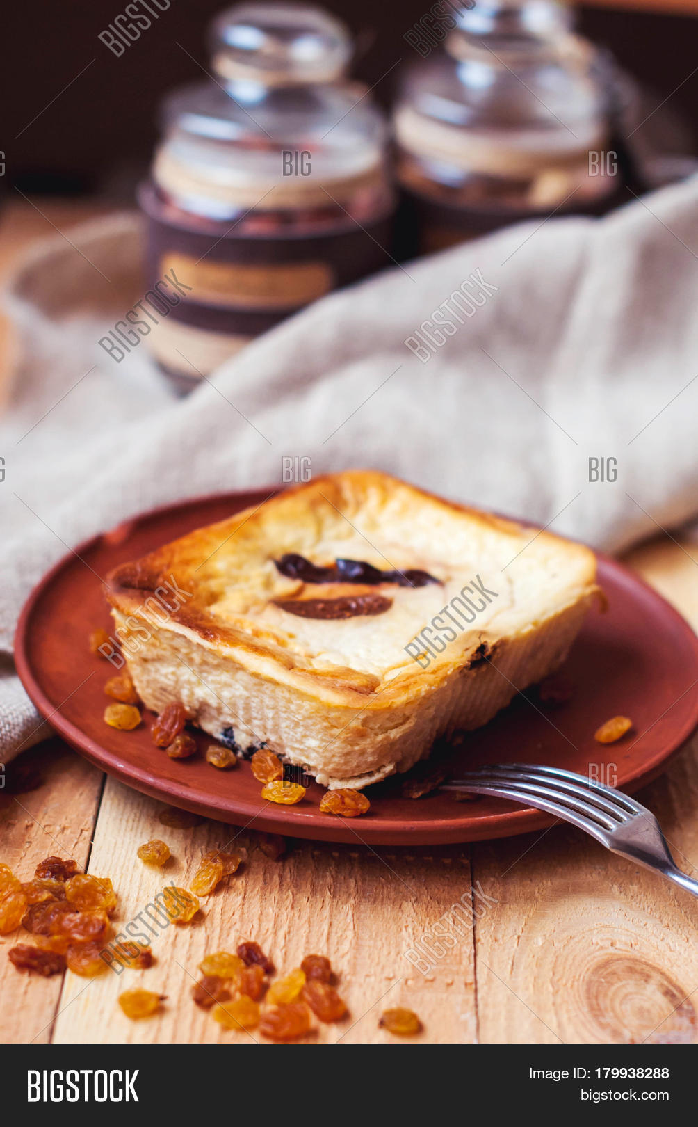 organic curd casserole with raisins and figs nuts on a wooden