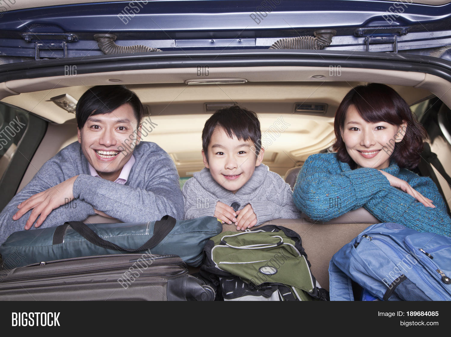 chinese family in packed car